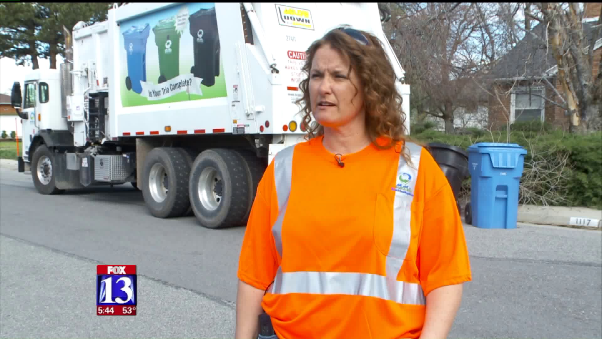 driven orange garbage truck